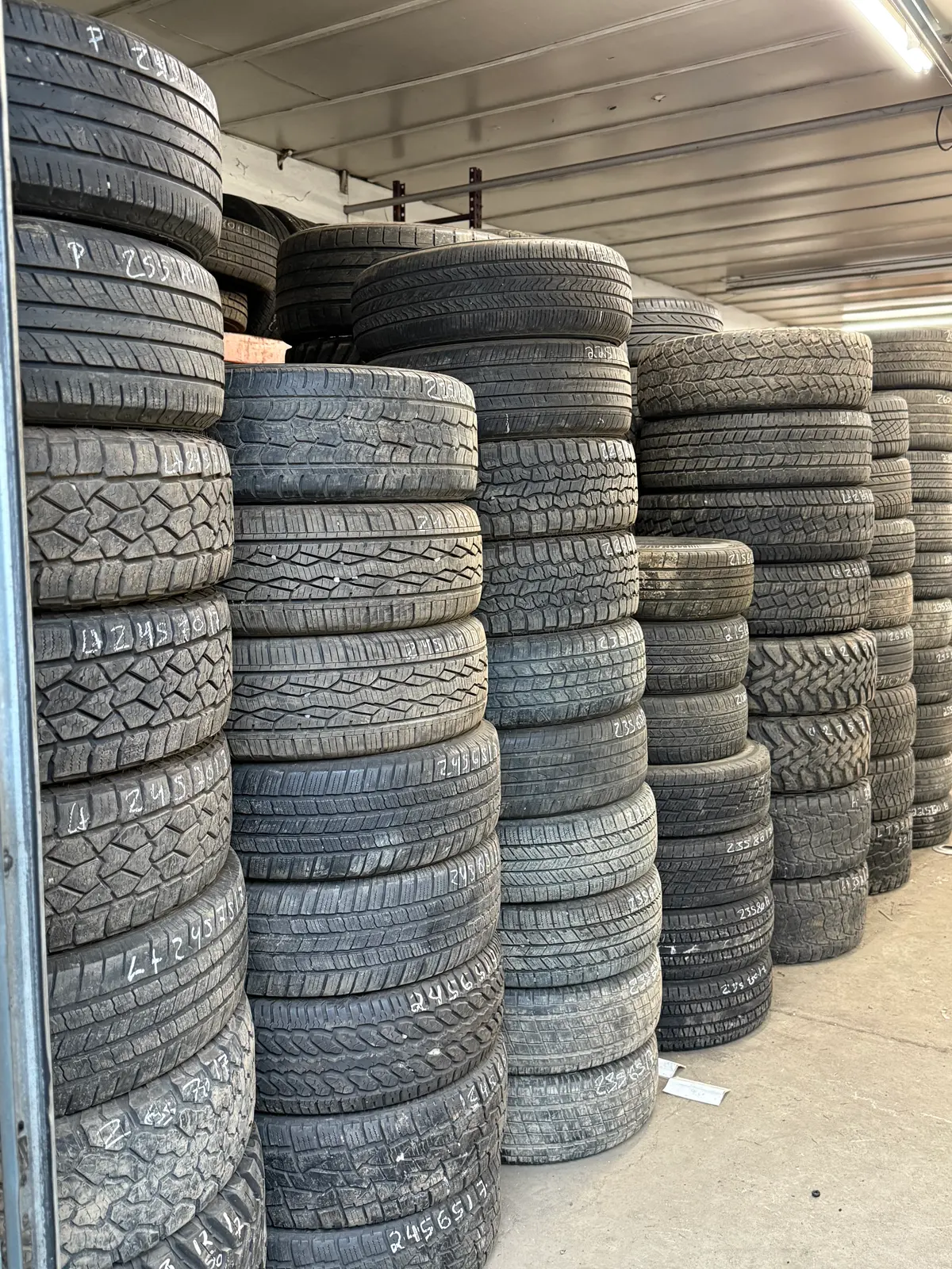 organized used tire inventory inside MC Wheels and Tires