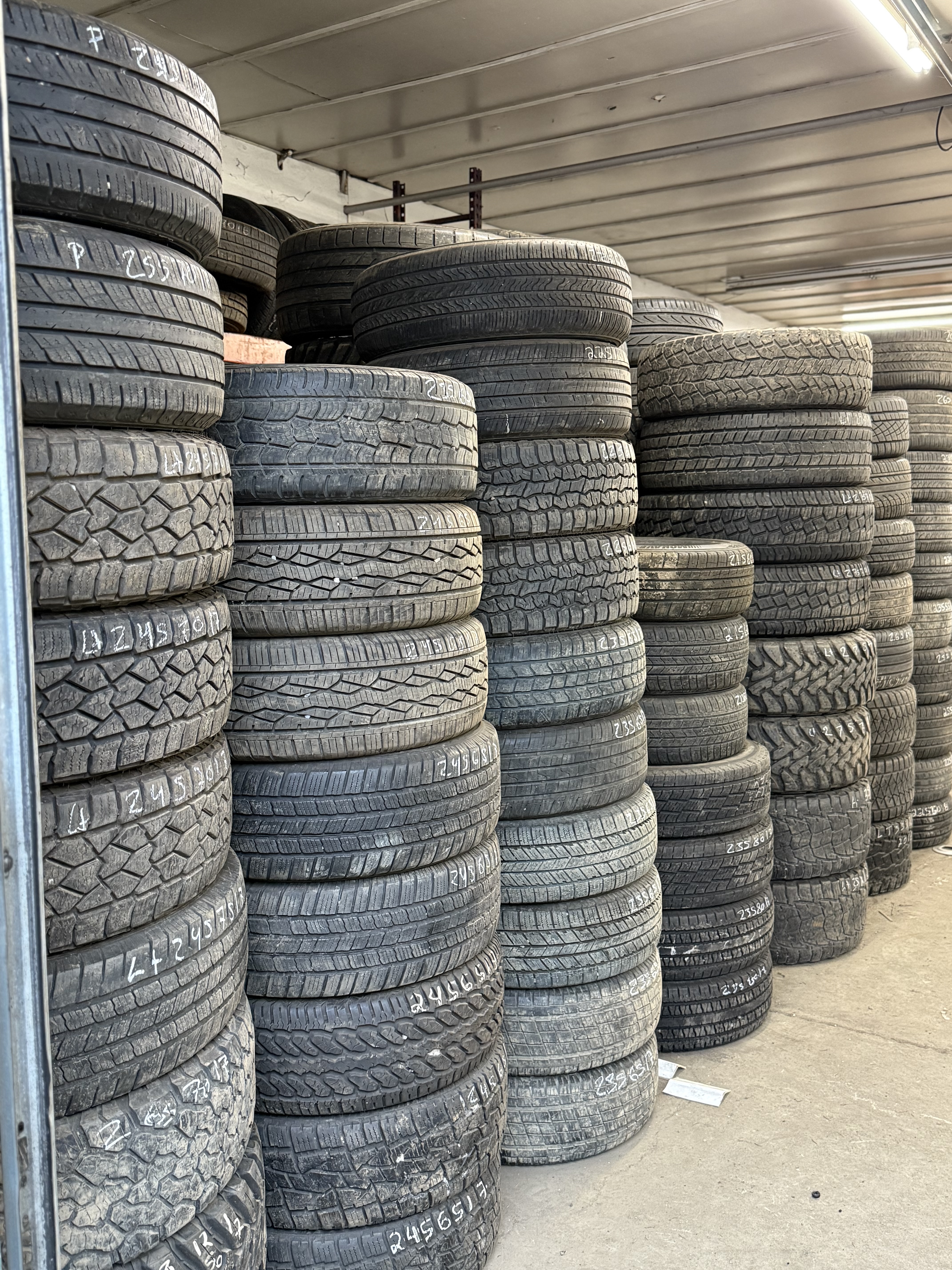 used tire inventory organized inside MC Wheels and Tires